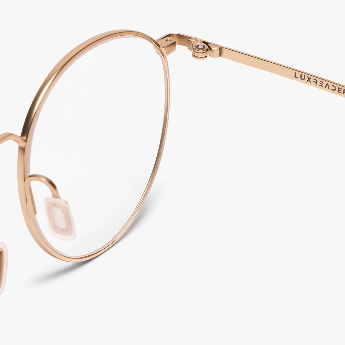 Round gold metal frame with Luxreaders branding on temple