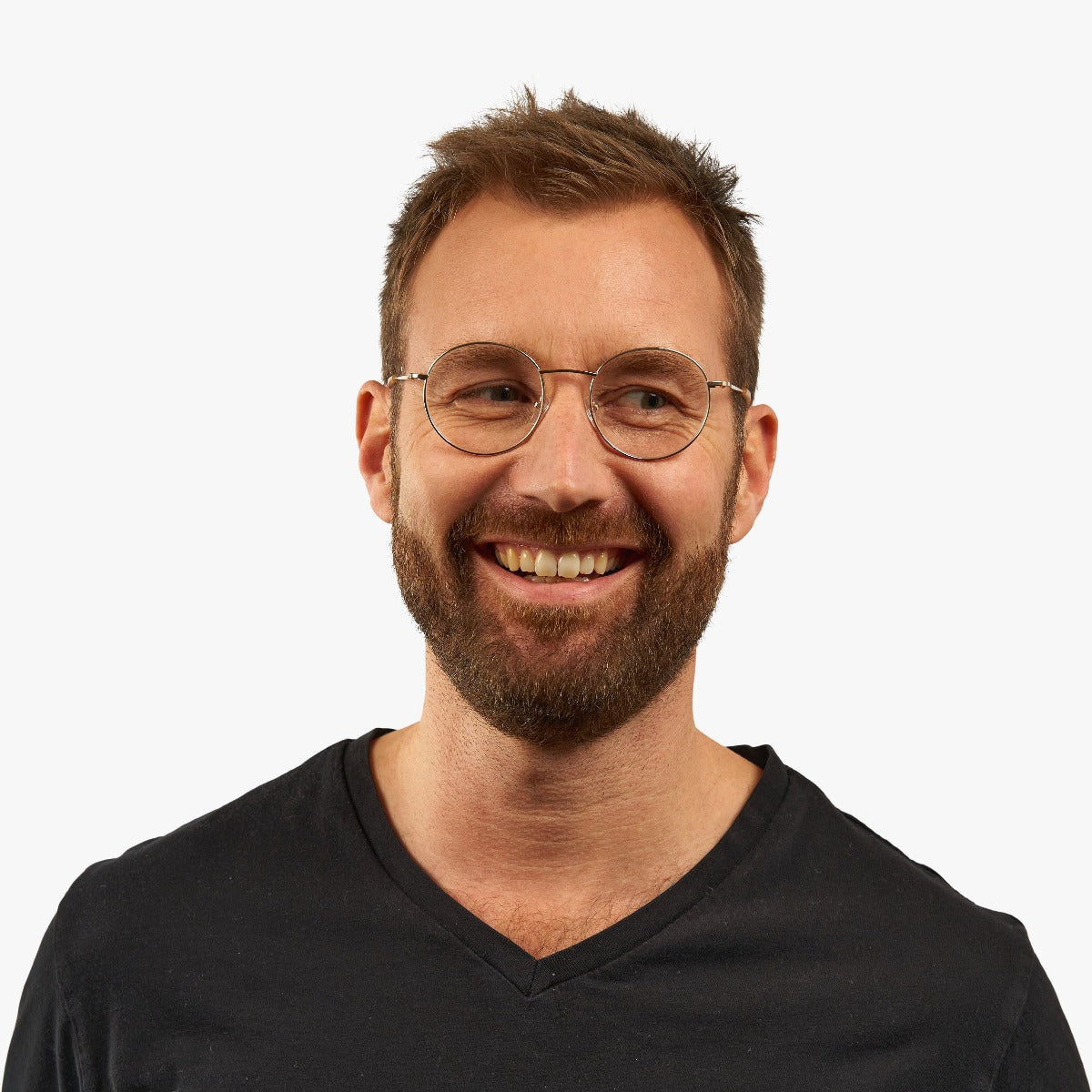 Person wearing Men's Tromsø Gold round glasses with gold temples