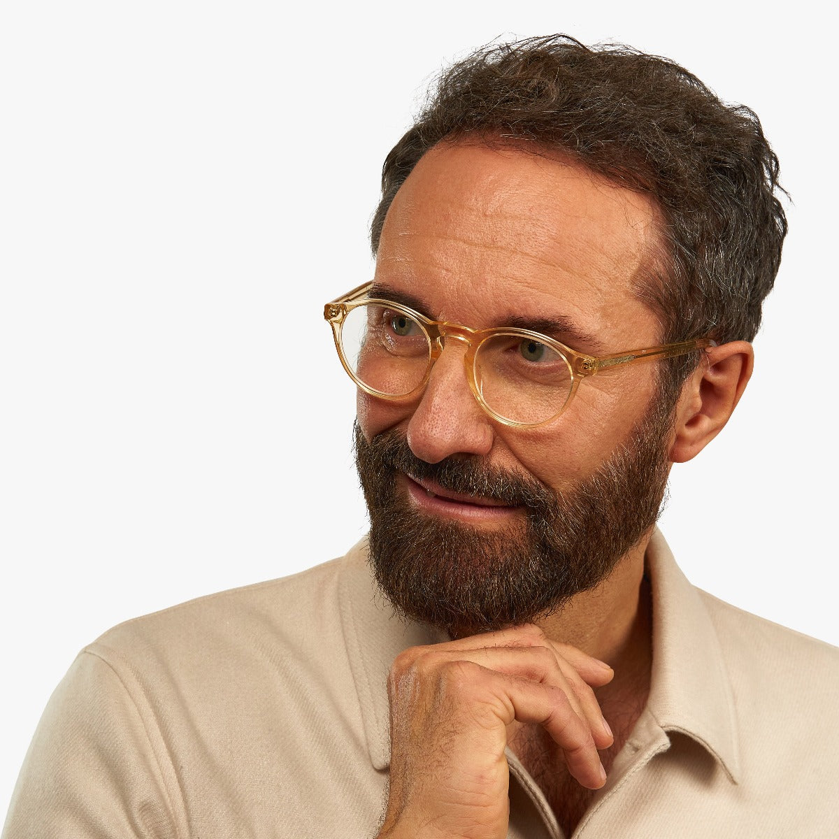 Person wearing crystal lemon reading glasses