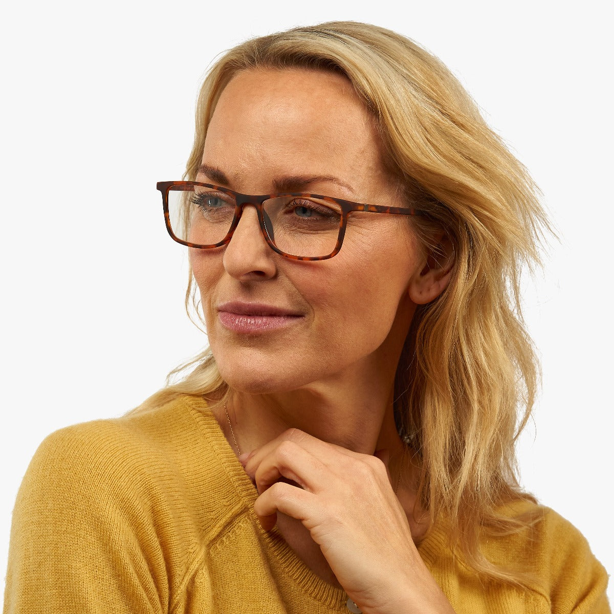 Person wearing Skagen Turtle reading glasses