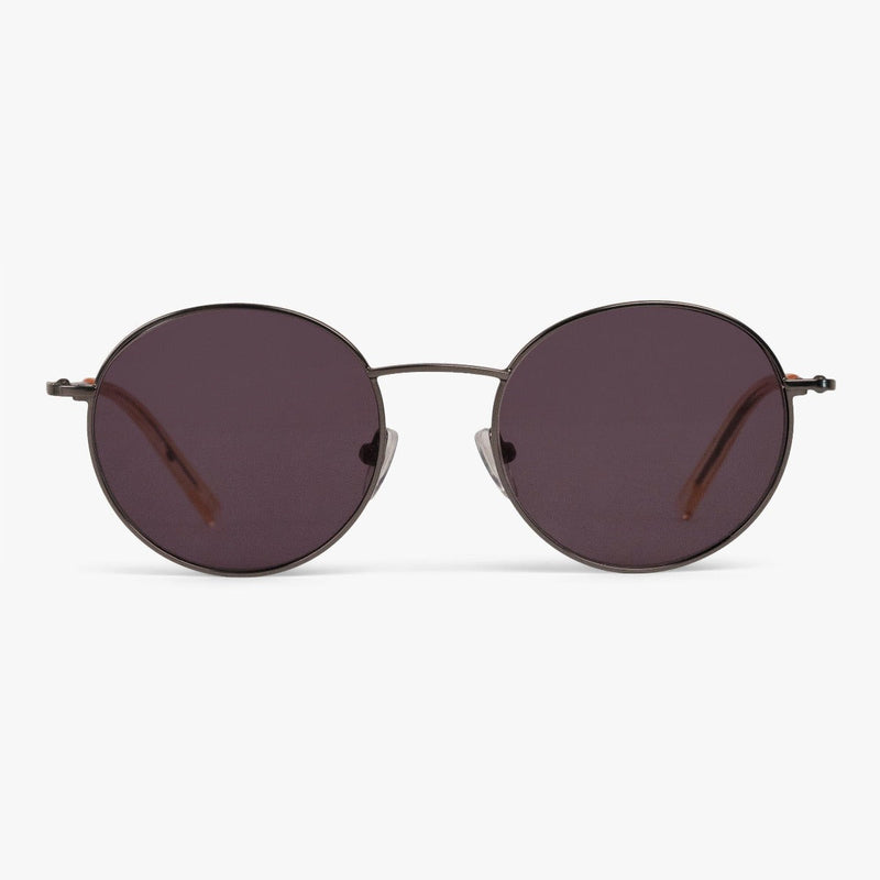 Round sunglasses with dark tinted lenses and sleek metal frame