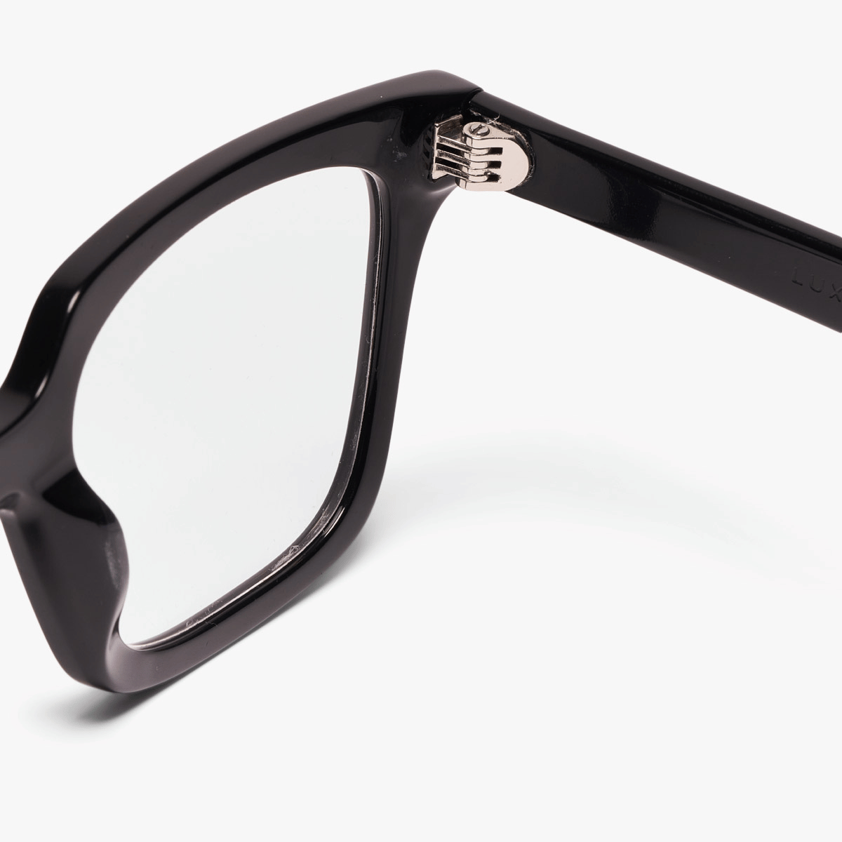 Close-up of Tisvilde Black eyeglass hinge with Luxreaders logo on temple